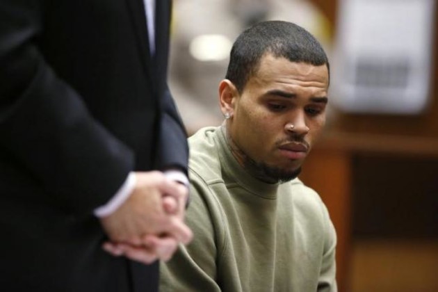 Singer Chris Brown who pleaded guilty to assaulting his girlfriend Rihanna, appears in court with his lawyer Mark Geragos for a progress hearing, in Los Angeles, California, January 15, 2015.  REUTERS/Lucy Nicholson/Files