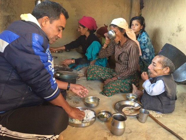 The late Dangi enjoying meal with his family in December 2014.