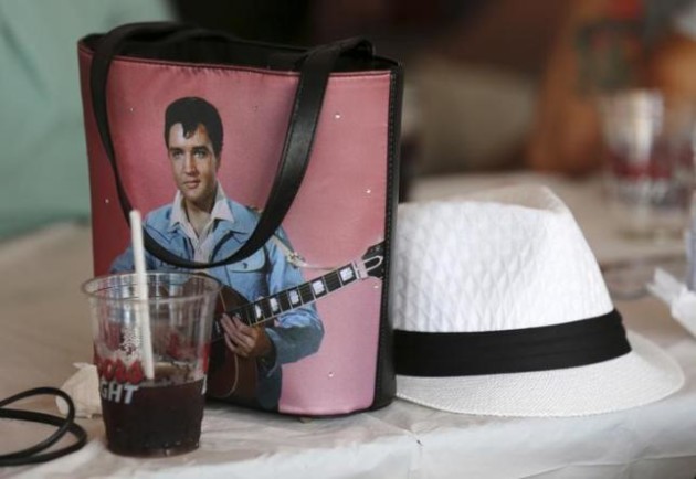 Purse featuring the image of Elvis Presley lies on a bar table during the Collingwood Elvis Festival