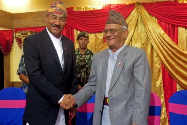 Kamal Thapa shakes hands with Lokendra Bahadur Chand