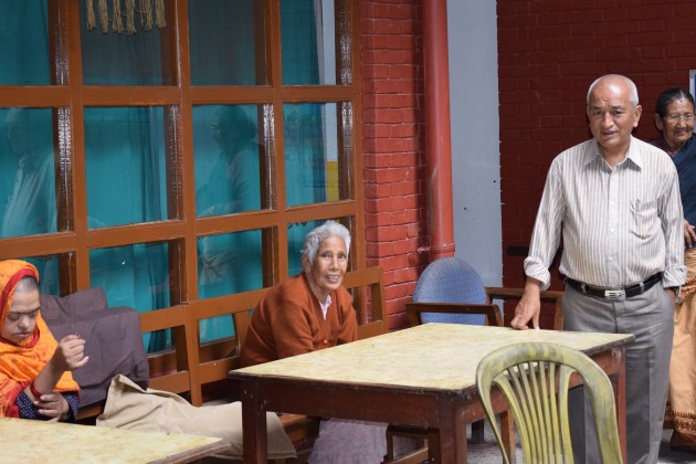 Dhaubhadel interacting with senior citizens.