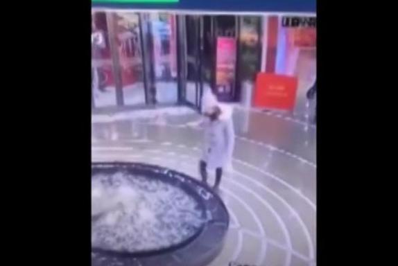 Phone-focused-shopper-walks-directly-into-mall-fountain