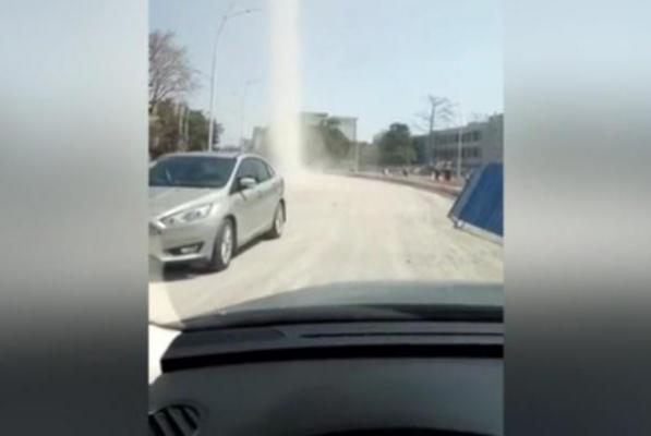Road-in-China-blocked-by-swirling-dust-devil