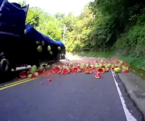 Watermelons-falling-from-truck-create-road-hazard