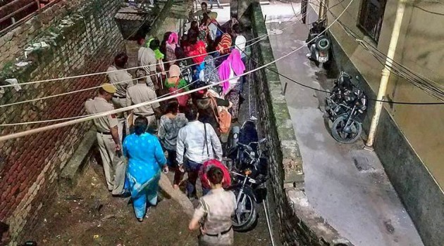 New Delhi: Police escort the Nepali girls after they were rescued by the efforts of Delhi Commission for Women from Munirka area of New Delhi on early Wednesday, July 25, 2018. 16 girls, who were on the verge of being trafficked to Gulf, were rescued. (DCW Photo via PTI) (PTI7_25_2018_000158B)